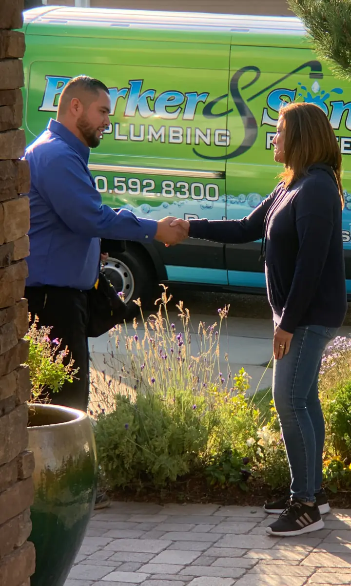 Plumber shaking hands with a customer