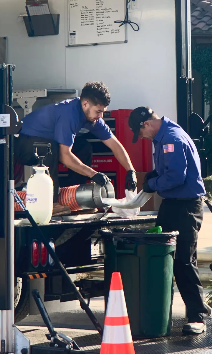 Plumbing installers fixing a broken pipe