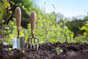 gardening tools in dirt