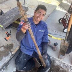 Barker and Sons Technician cleaning a drain for one of his customers