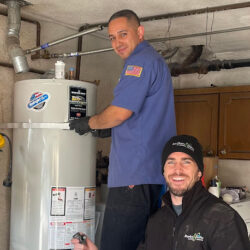 Barker and Sons technicians installing a water heater