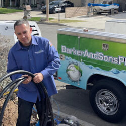 Barker and Sons technicians installing sewer lines to a customers home.