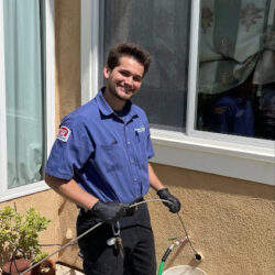 Barker and Sons technician performing drain cleaning on a customers home