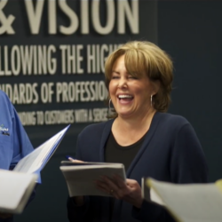 Mike Barker and Brenda Barker leading a team meeting.