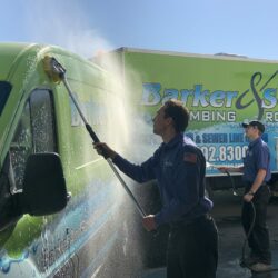 Barker and Sons Technicians cleaning their service trucks.