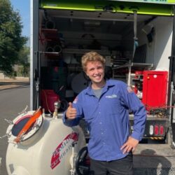 Barker and Sons technician performing sewer cleaning and repair