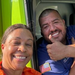 Barker and Sons technician posing with a happy customer.