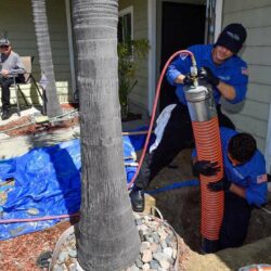 Barker and Sons technicians performing trenchless sewer repair on a customers home.